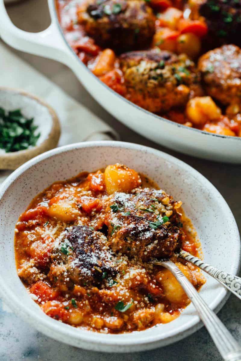 Cauliflower gnocchi and meatballs is a cozy alternative to the classic spaghetti and meatballs. All made in one-skillet! Who can complain?!