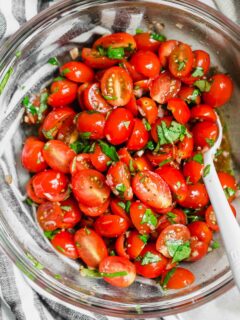 This is the best summer tomato salad! With a short ingredient list, this fresh salad will have you making it all summer long! #tomato #tomatosalad #summersalad #freshingredients