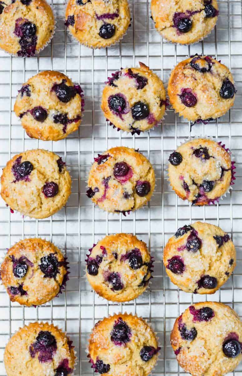 These tender blueberry overload muffins are literally overflowing and FILLED with fresh blueberries! They're so soft, tender, and just like straight out of a bakery!