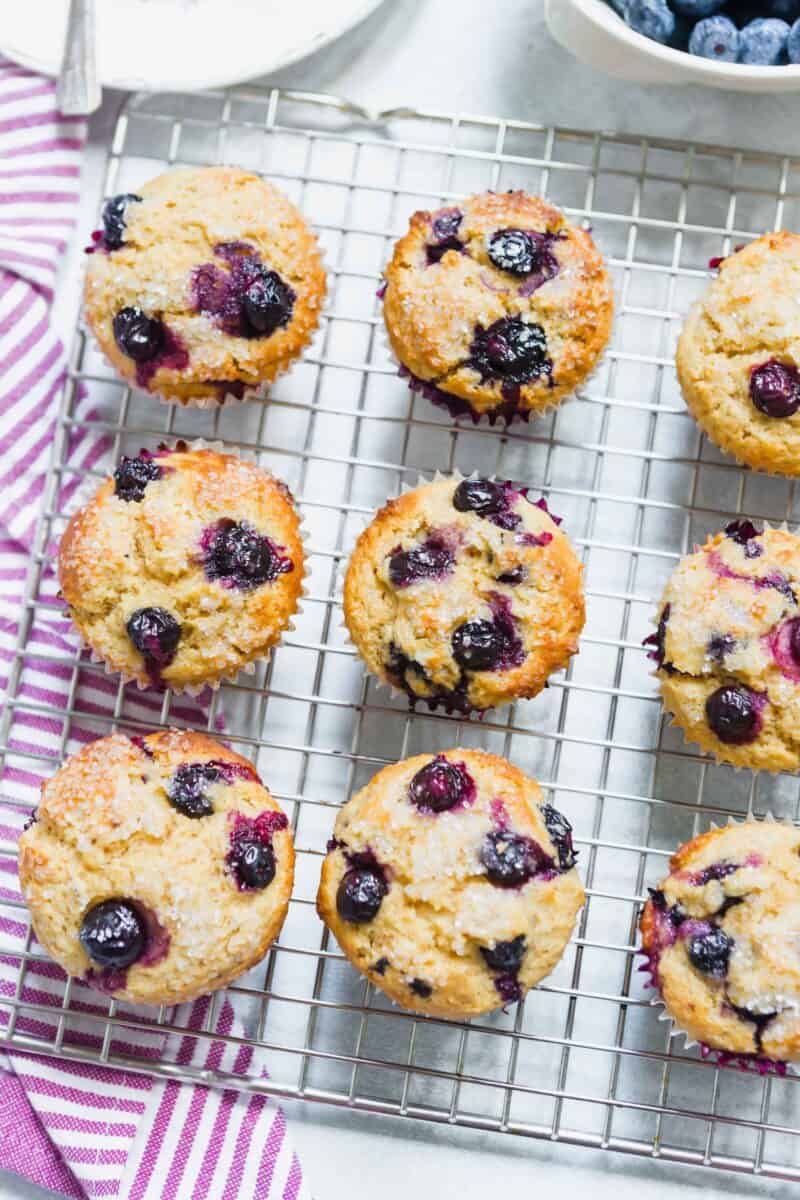 These tender blueberry overload muffins are literally overflowing and FILLED with fresh blueberries! They're so soft, tender, and just like straight out of a bakery!