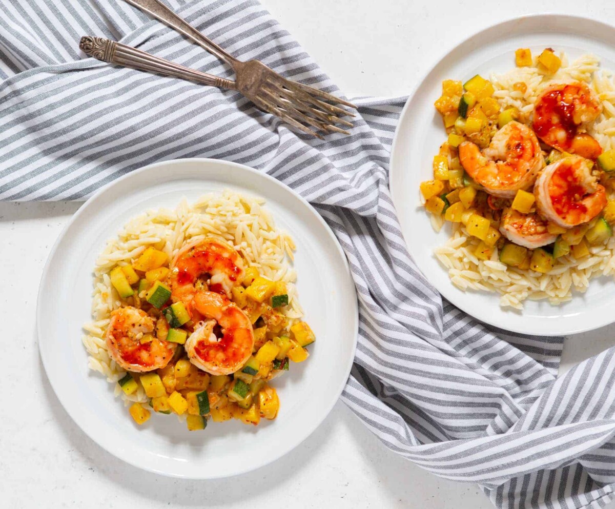 A quick and easy weeknight dinner that features shrimp, zucchini, and orzo! These ingredients are perfect together!