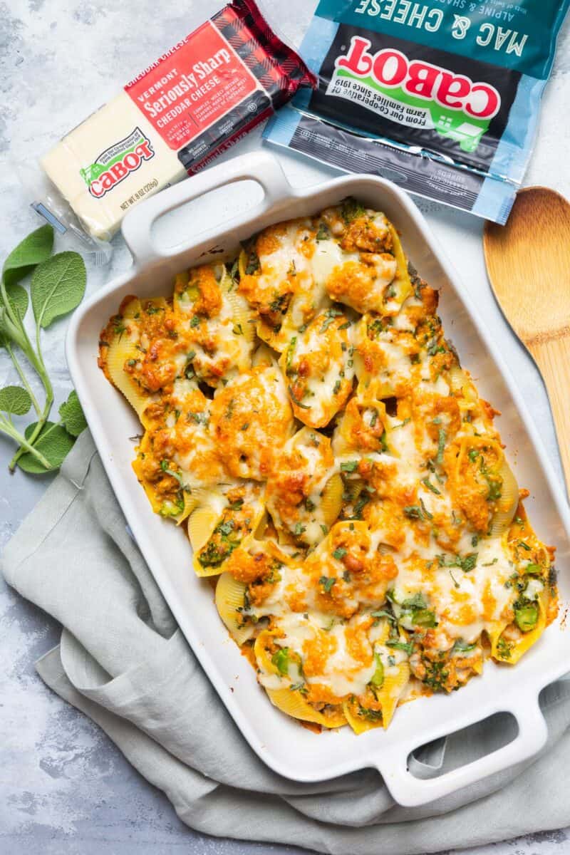 Filled with spicy sausage, broccolini, and a cheesy pumpkin sauce, this pumpkin stuffed shells recipe is the ultimate Fall comfort food!