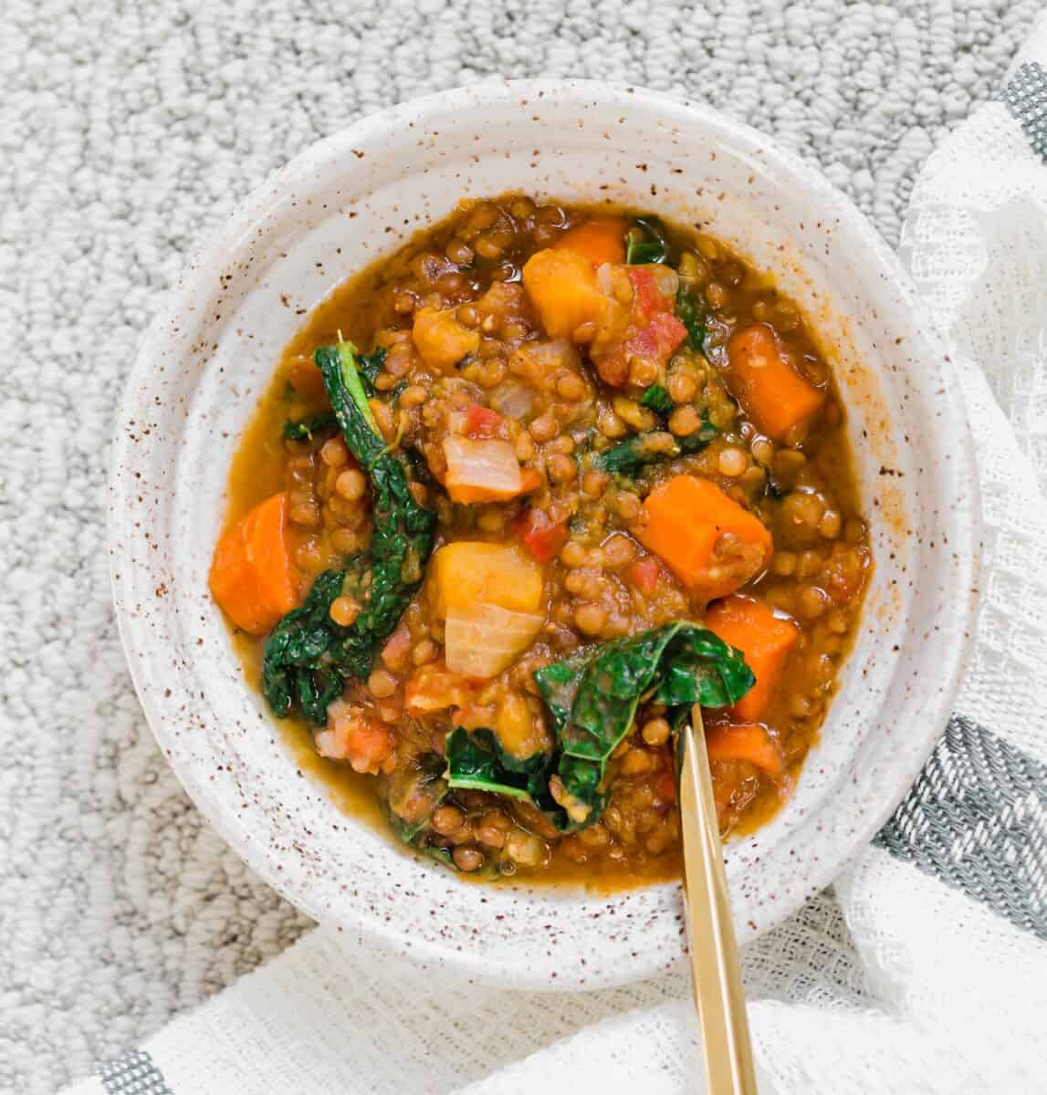 A quick lentil soup made in the Instant Pot and loaded with veggies for a deliciously cozy soup for any time of year!