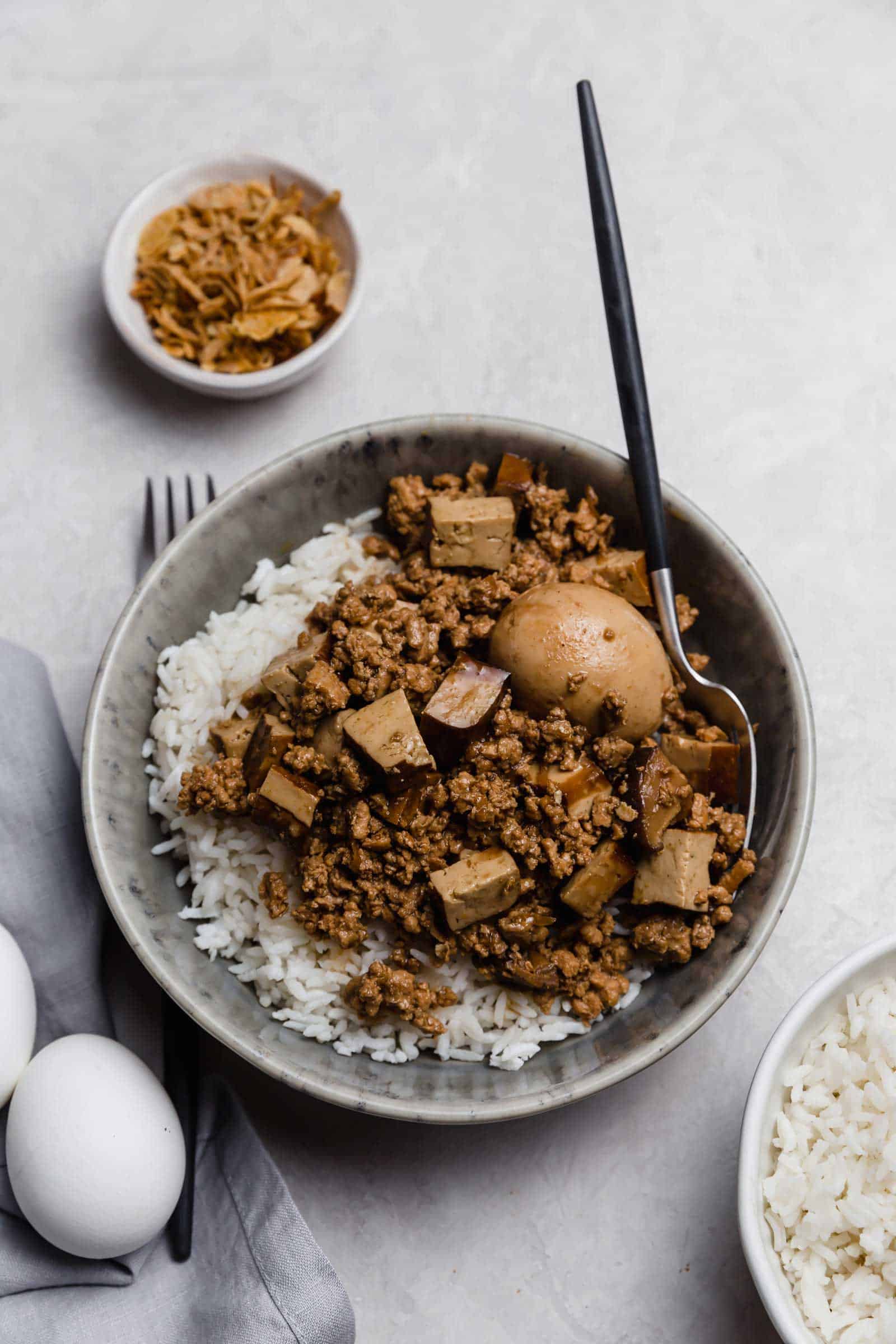 Bowl of minced pork with a hard-boiled egg.