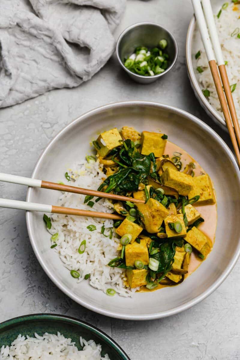 This tofu coconut curry bowl is simmered in a deliciously warm coconut curry sauce along with shiitake mushrooms. A plant-based dinner for any evening!