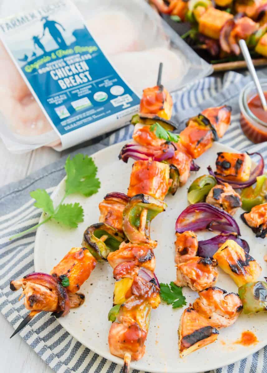 Grilled pineapple bbq chicken kabobs are the perfect summer grilling meal! A deliciously sweet and tangy BBQ sauce is slathered all over these chicken kabobs!