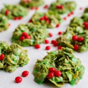 red hots are scattered across a batch of wreaths