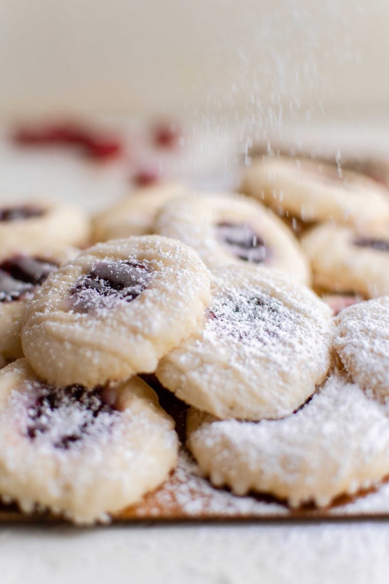 Beautiful raspberry thumbprint cookies are a classic and they can be filled with whatever jam or jelly you love!