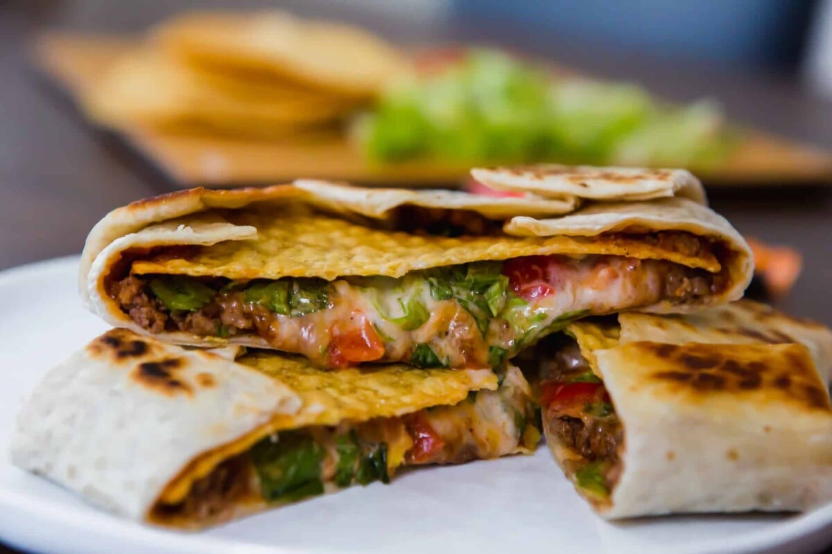 This homemade Crunchwrap Supreme recipe is going to satisfy all your Taco Bell cravings! It's filled with meaty, cheesy, crunchy goodness!