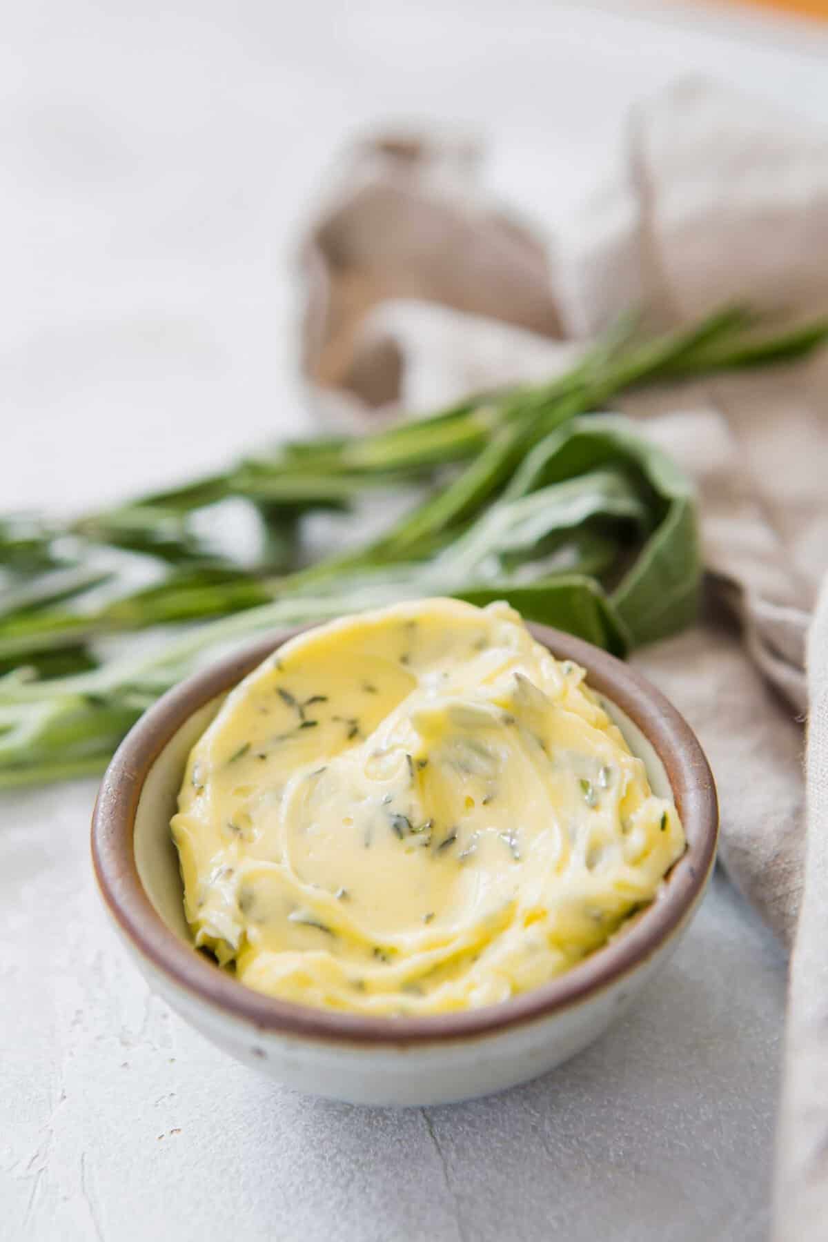 Closeup shot of softened compound butter in a small bowl