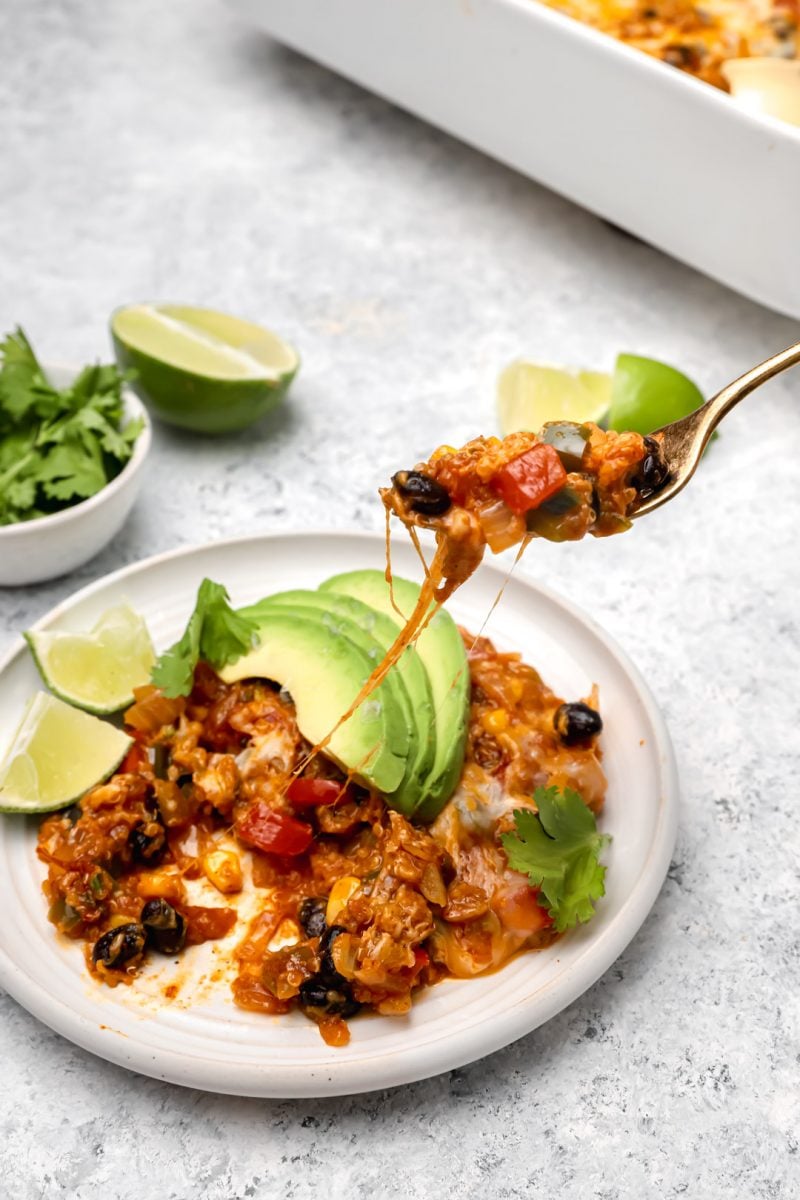 This quinoa enchilada bake makes dinner a breeze! It is full of flavor and comes together in no time!