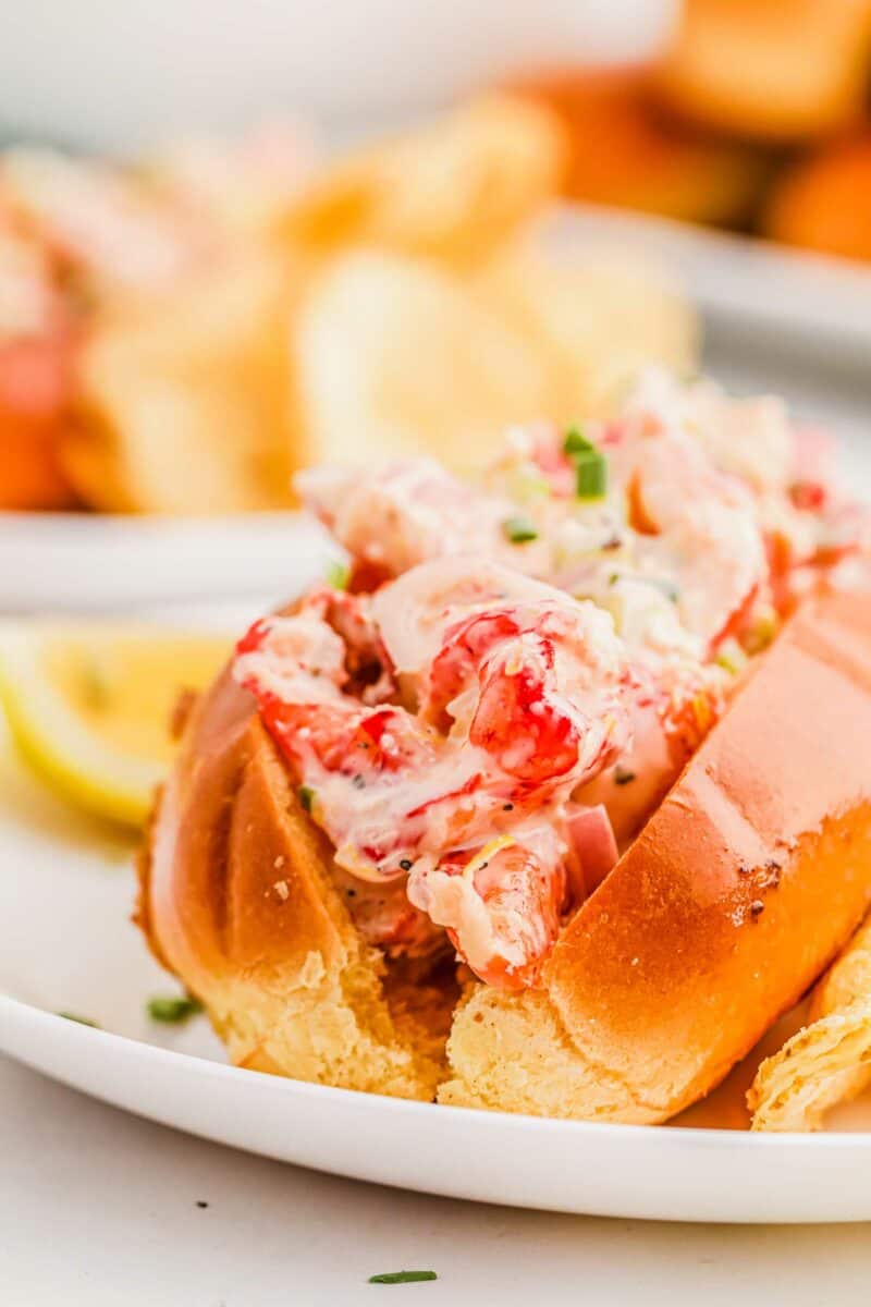 Lobster meat is placed in a toasted bun. 