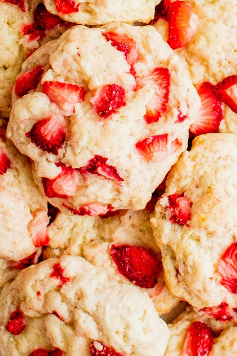 Strawberry pieces have been baked into soft white cookies. 