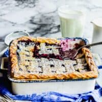 A spatula is lifting a piece of pie from the baking dish.