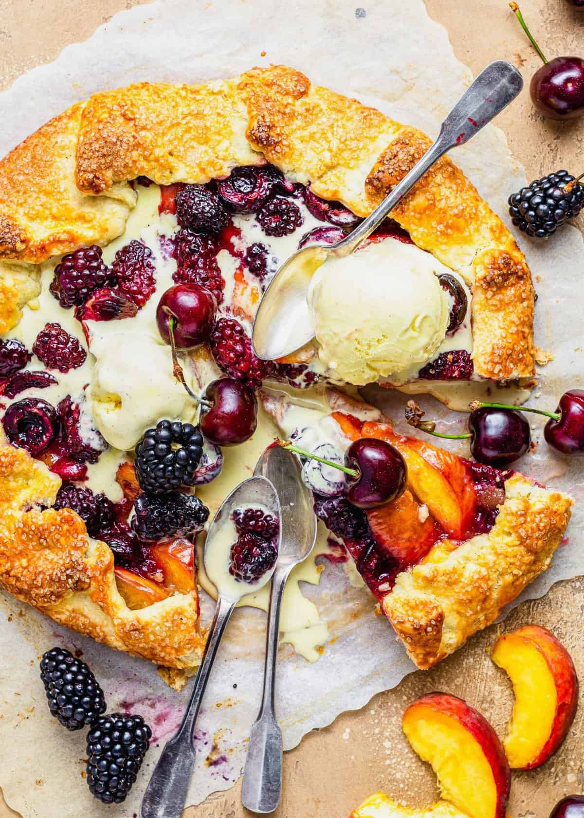 Melted vanilla ice cream is spread out over a galette. 