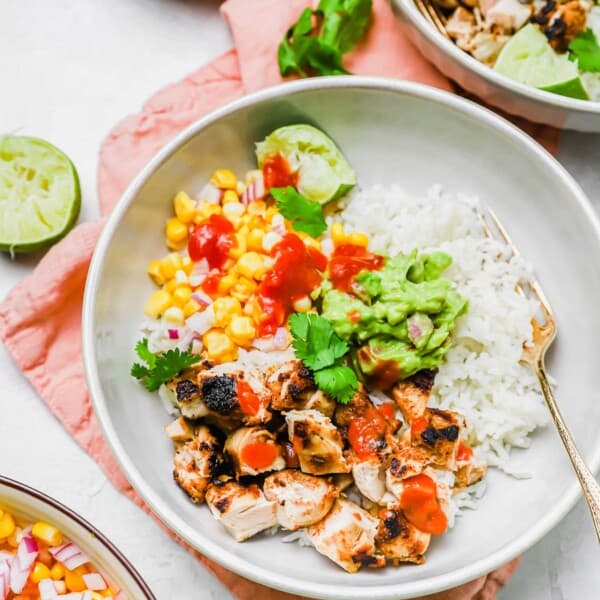 Overhead view of grilled chicken burrito bowl with fork