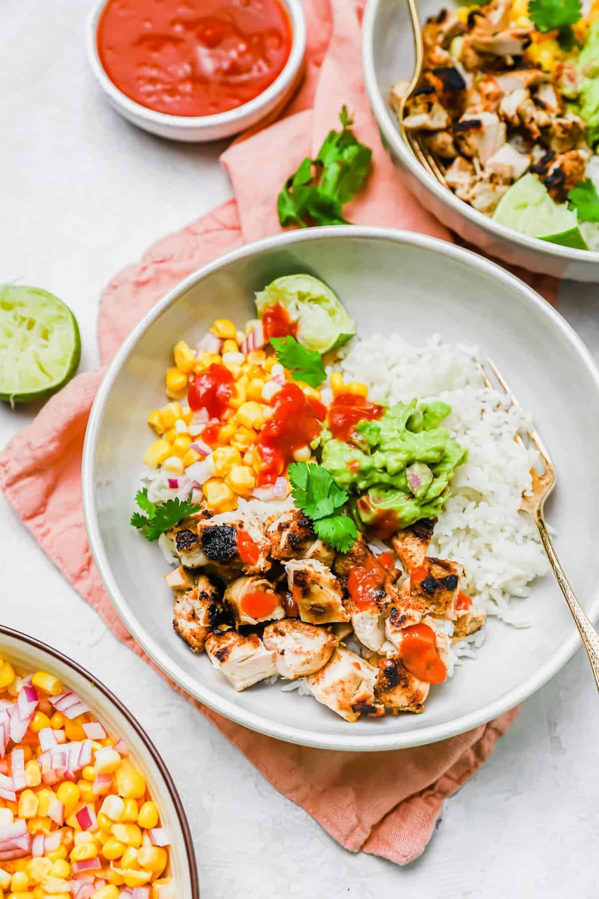 Overhead view of grilled chicken burrito bowl with fork