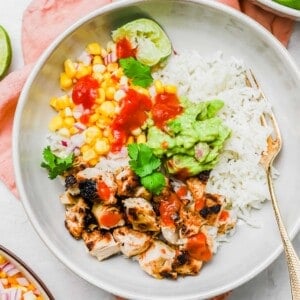 Overhead view of chicken burrito bowl with fork