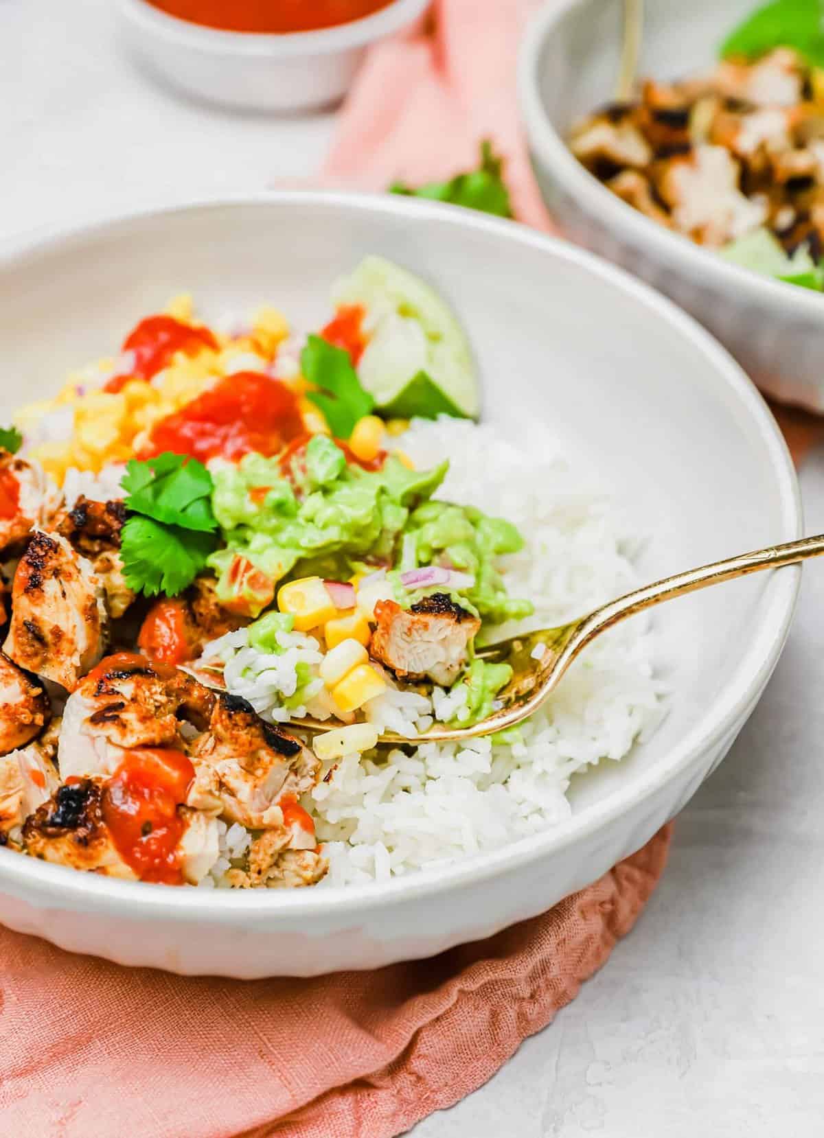 Closeup of burrito bowl with fork