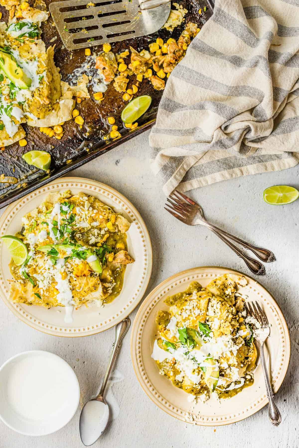 Several plates are filled with portions of enchiladas. 