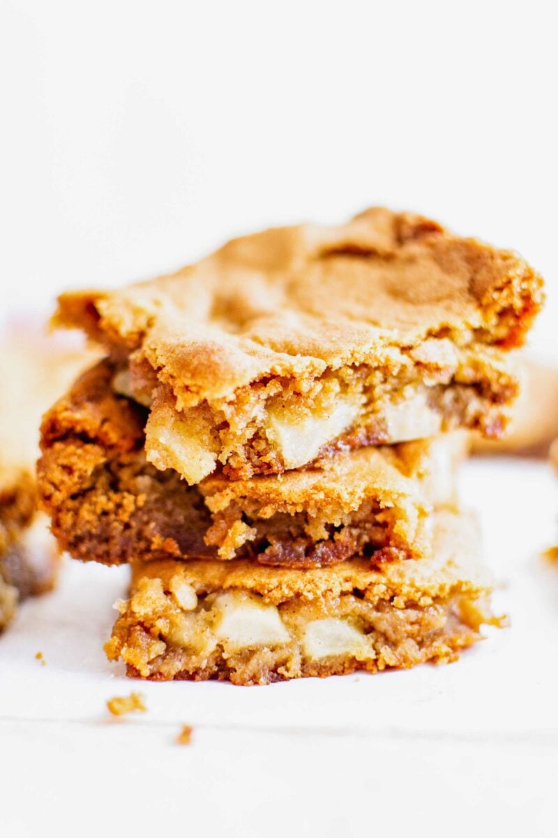 Three slices of blondies are stacked on top of one another. 