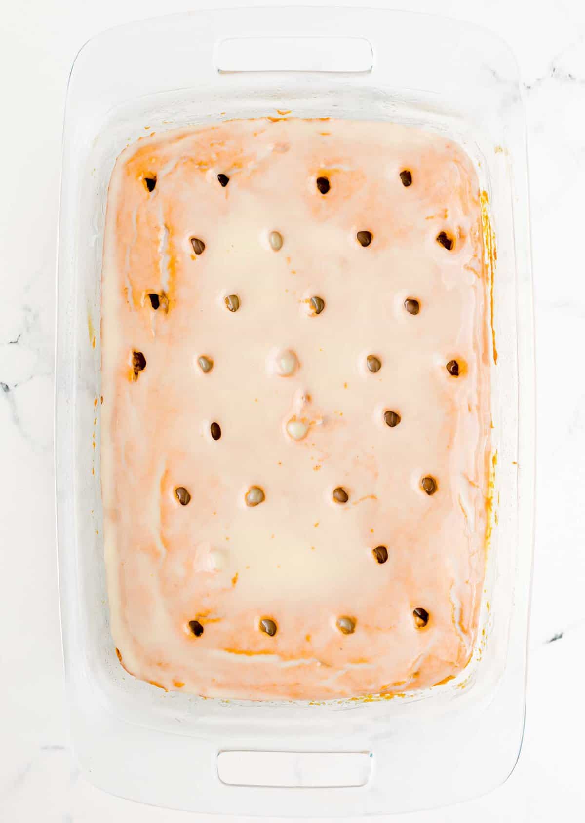 Pumpkin cake with holes and cream chilled