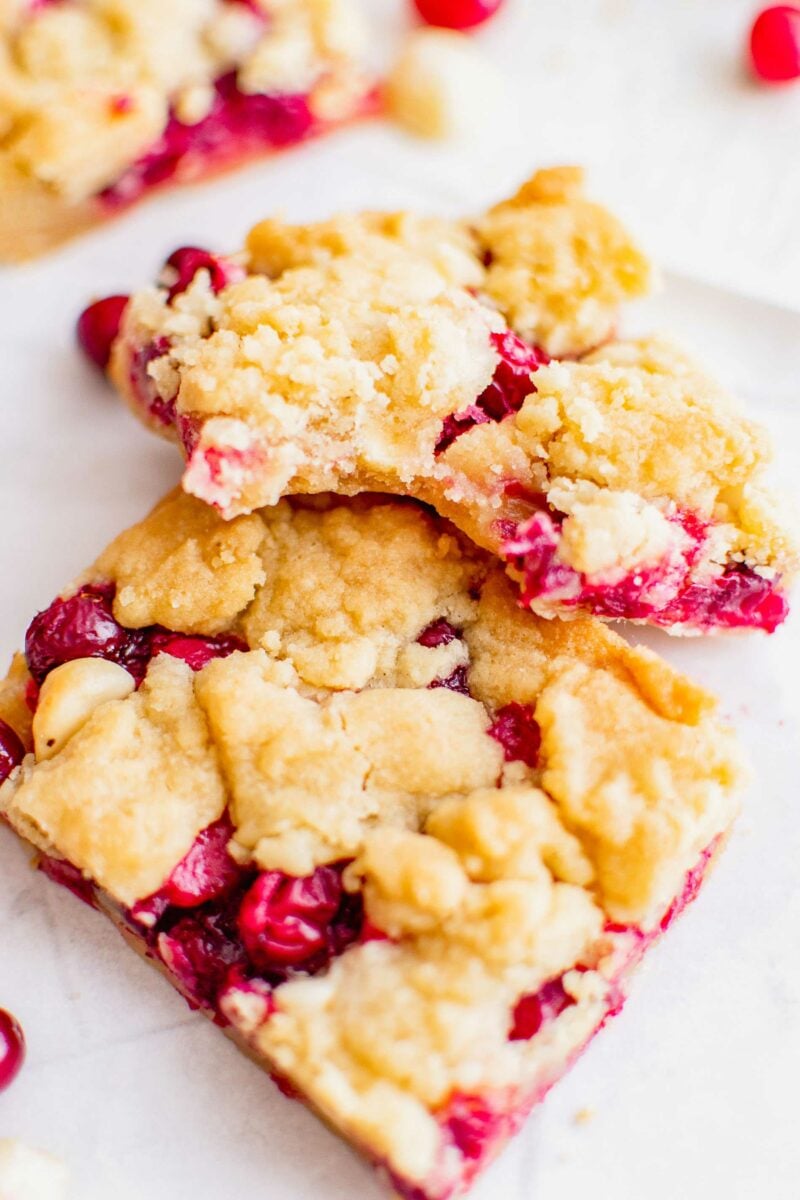 A bite has been taken out of a cranberry shortbread bar. 