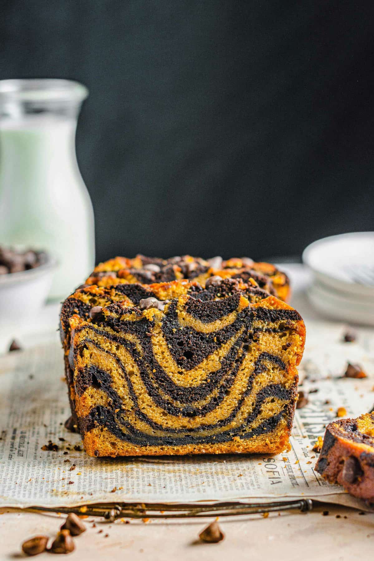 Marbled bread has been sliced, revealing a swirled center. 