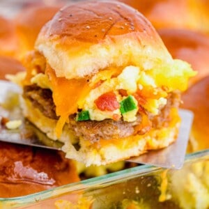 Breakfast slider being lifted out of baking dish