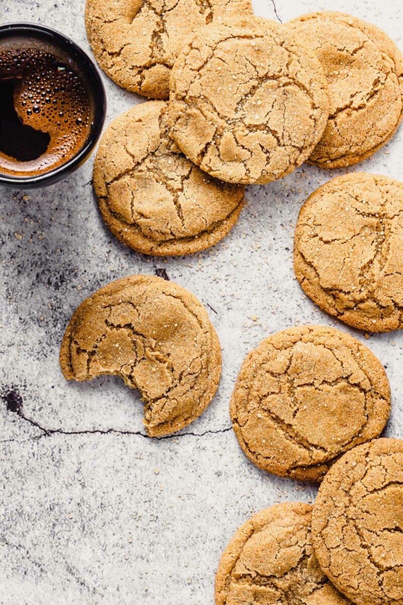 Out of a large batch, one cookie has been bitten into. 