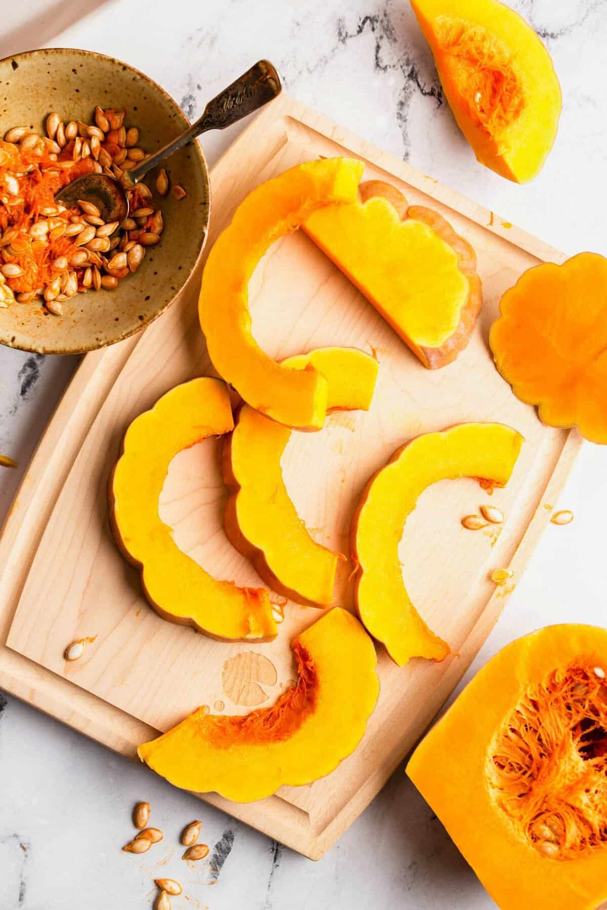 Overhead view of koginut squash slices on cutting board