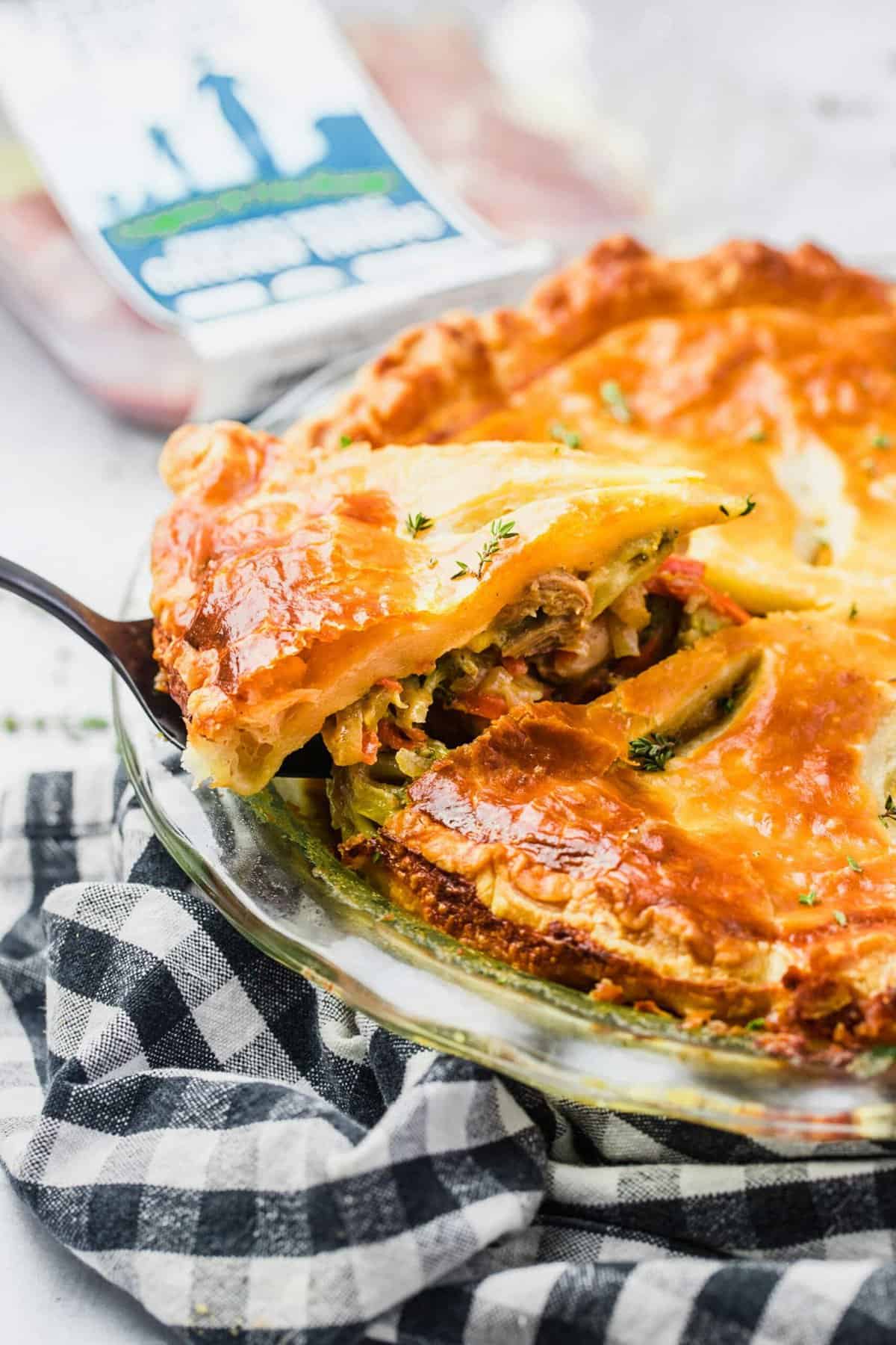 Slice of pot pie being removed from baking dish