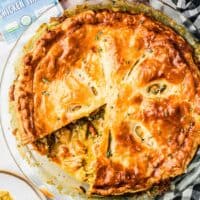Overhead view of broccoli cheddar pot pie with one slice removed