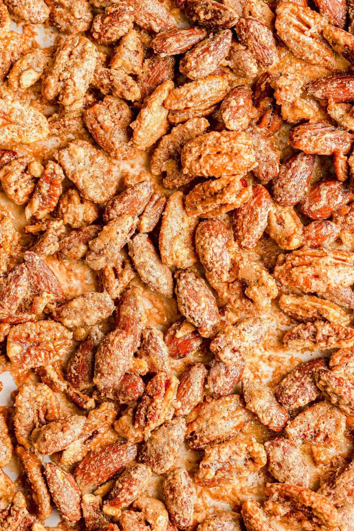 Spiced nuts on parchment-lined sheet pan