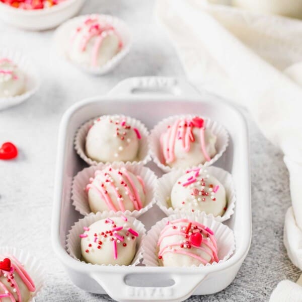Six red velvet truffles decorated for Valentine's Day in small dish
