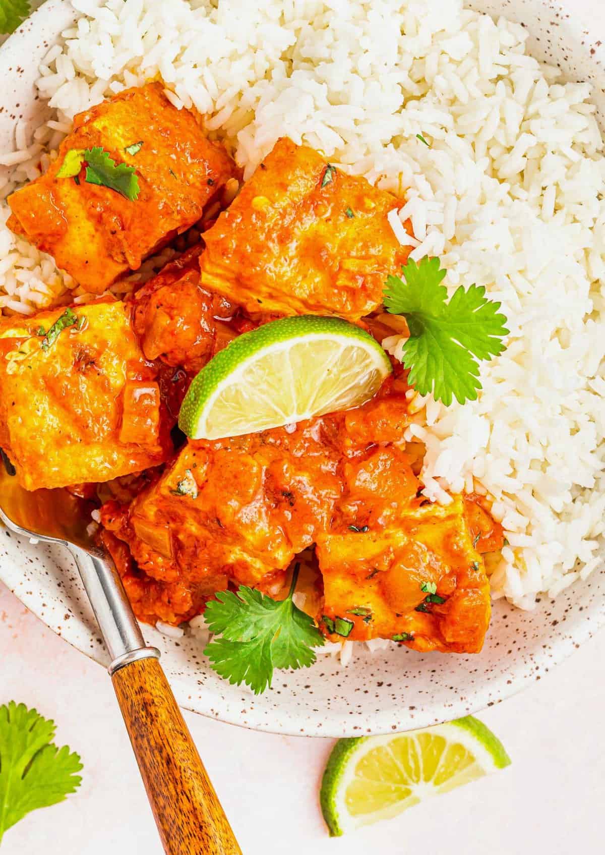 Overhead view of Coconut Caribbean Tofu in bowl with white rice