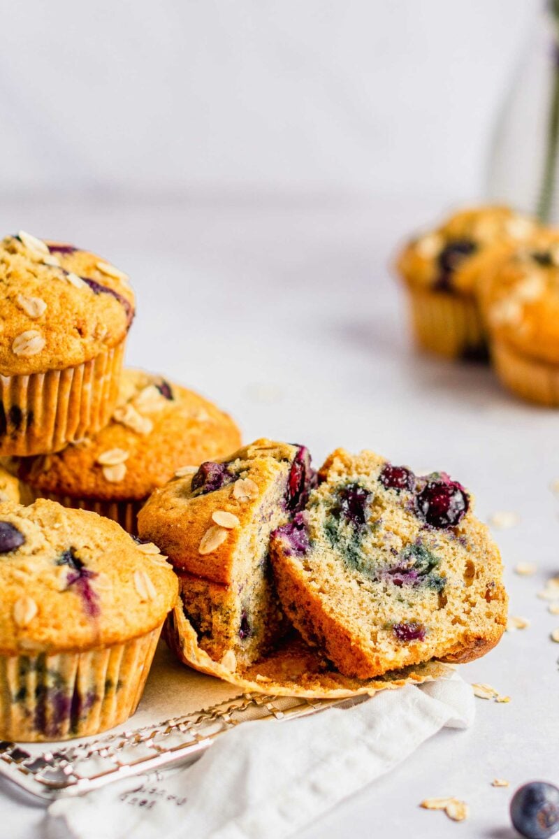 A muffin has been cut in half, revealing a fully baked center. 