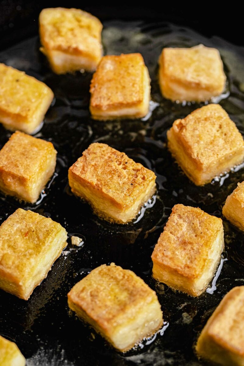 Crispy cubes of tofu in a pan