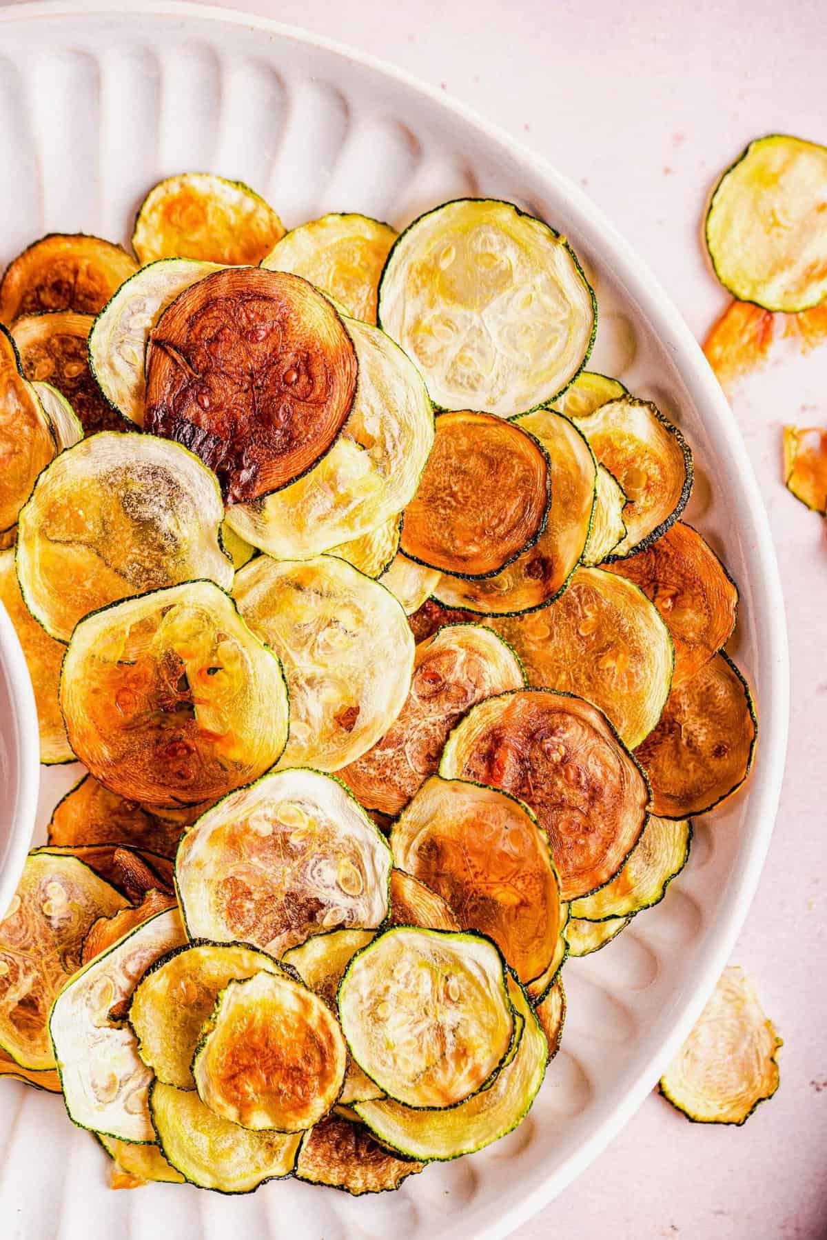 Zucchini chips on white plate