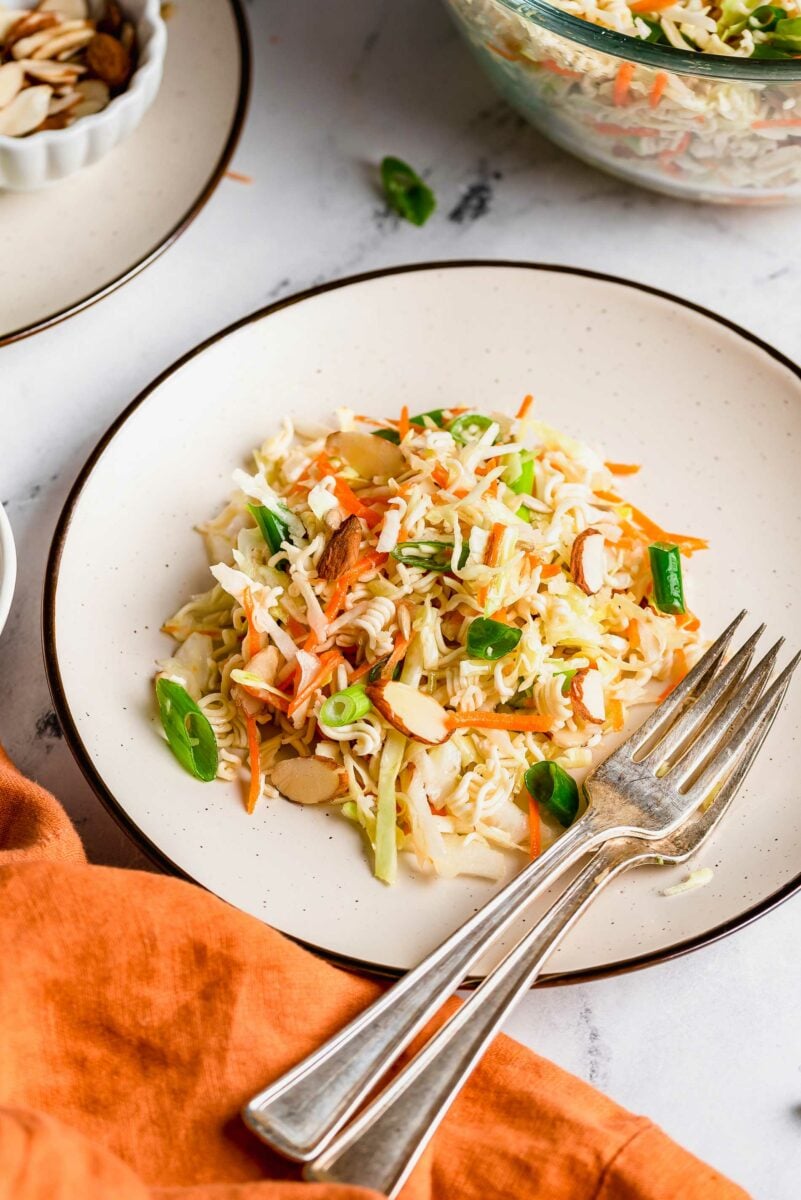 Asian ramen salad on a white plate.