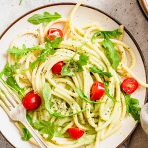 Plate of creamy avocado pasta with fork