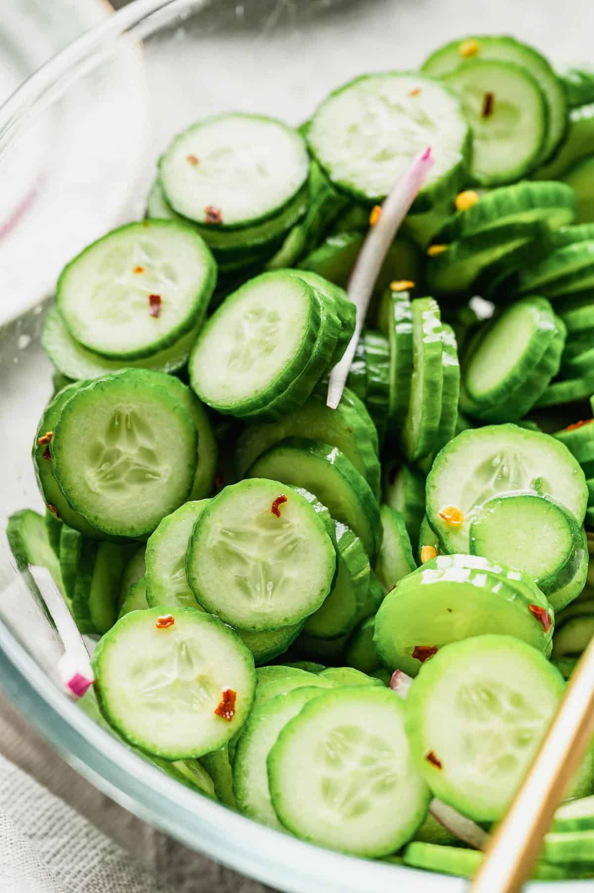 Cucumber salad in large glass bowl