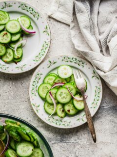 Overhead view of cucumber salad on plates