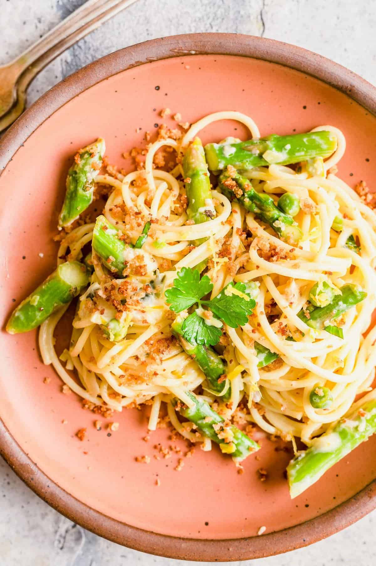 Overhead view of asparagus and lemon pasta on plate