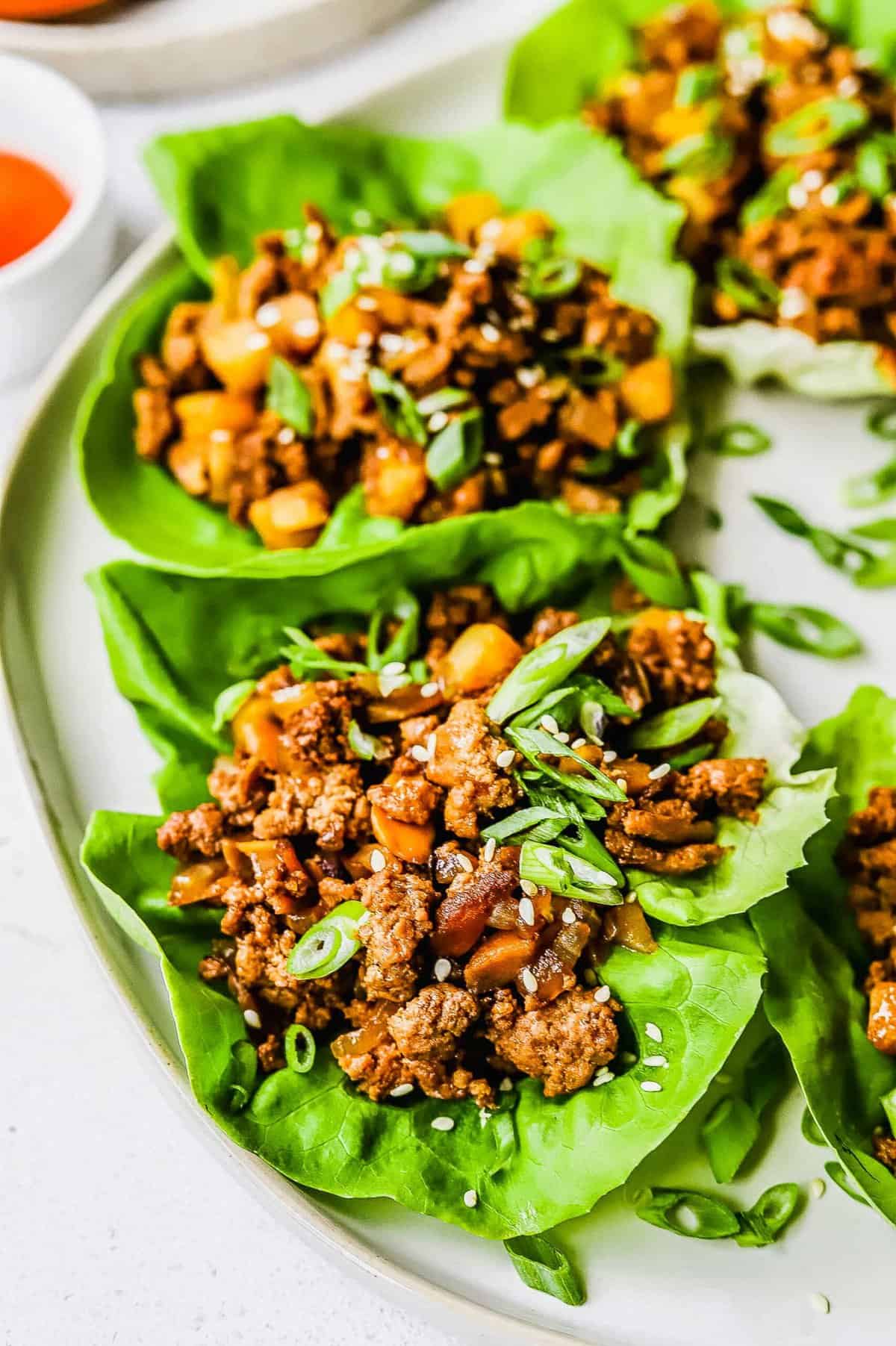 Ground chicken and mushrooms wrapped in a lettuce leaf.
