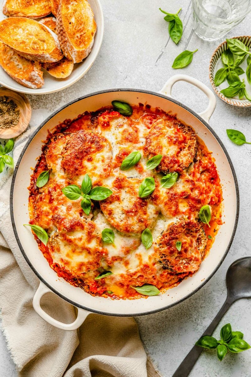 overhead shot of eggplant parmesan in round casserole dish