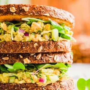 Two stacked smashed chickpea sandwiches