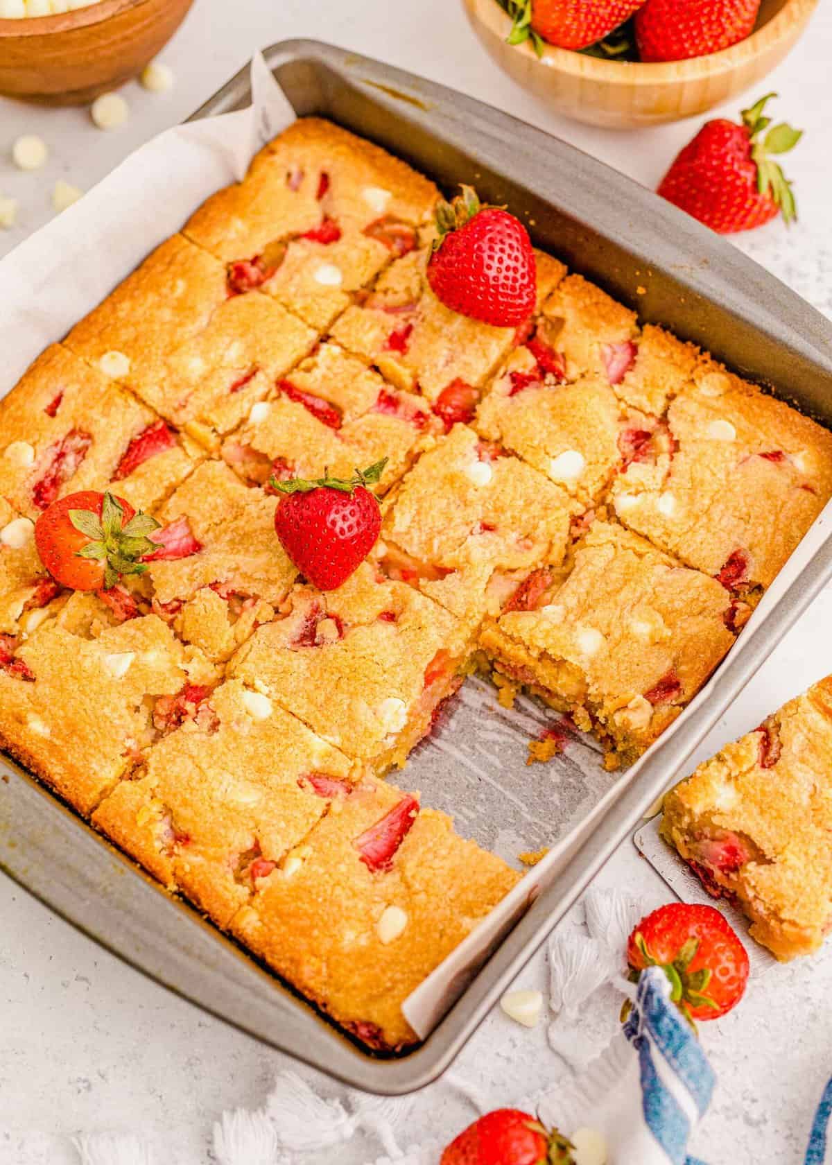 Pan of strawberry blondies with one removed