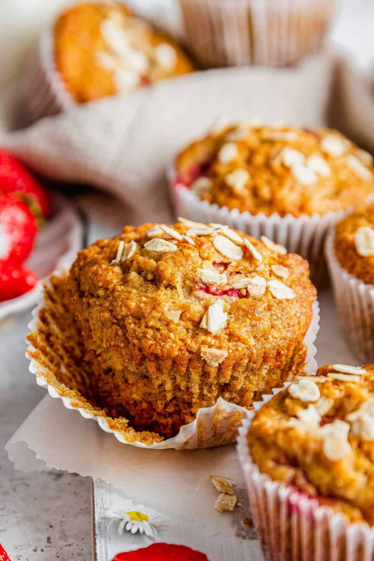 Strawberry oatmeal breakfast muffin with loosened wrapper