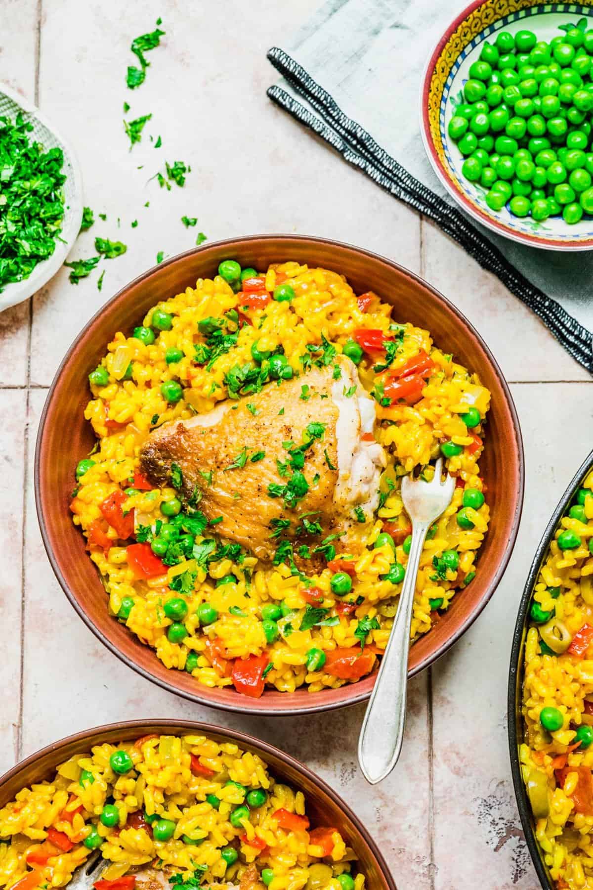 Overhead view of arroz con pollo in bowls